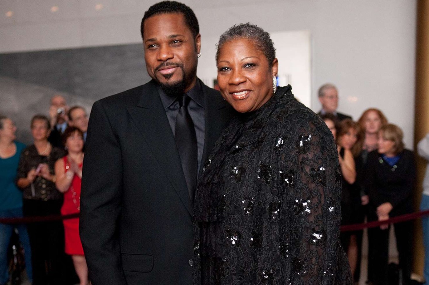 The wife of Malcolm-Jamal Warner is suing his mother over the actor's assets.